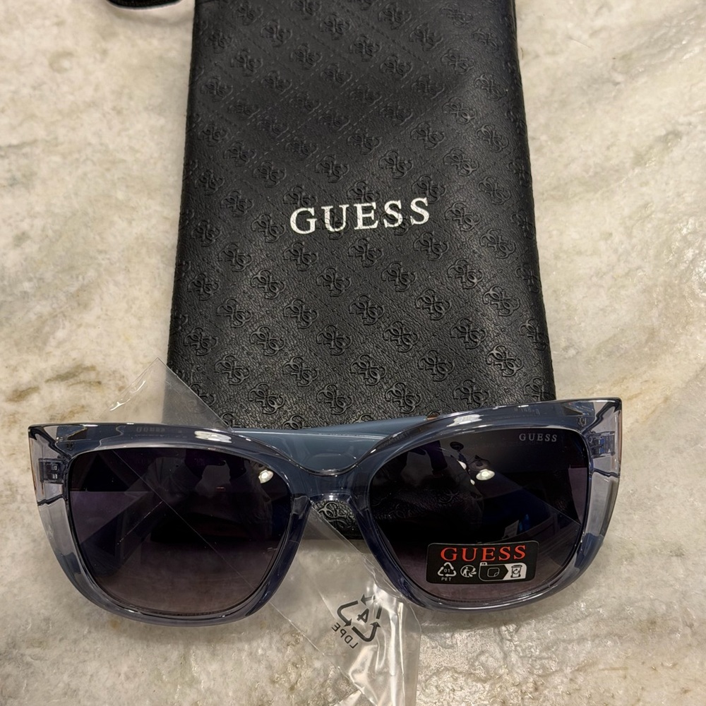 GUESS Transparent Light Purple Sunglasses with Dark Lenses